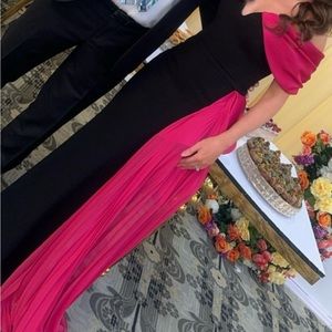 Elegant black dress with hot pink bow.